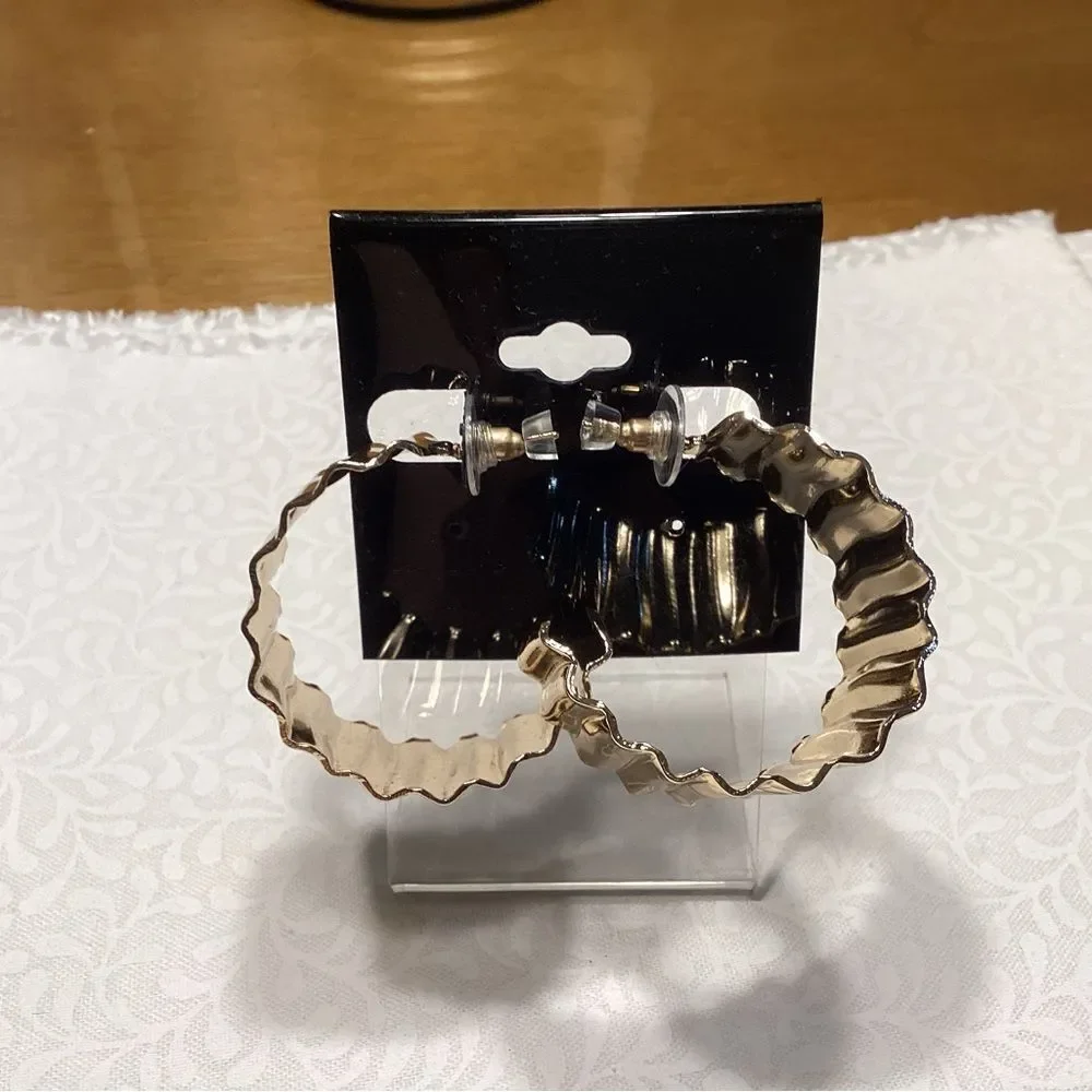 NWOT. Goldtone Wavy Hoop Large Pierced Earrings